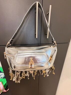 AKIRA Metallic Silver Shoulder Bag with Key Charm Fringe